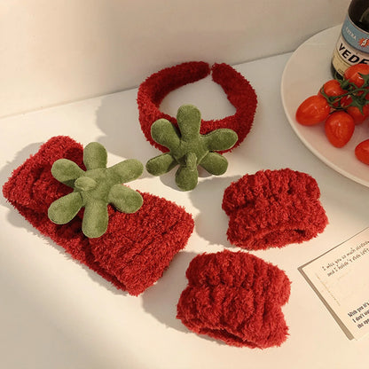 plush cat ears headband set 3pcs in red with green flower accents displayed on a table.